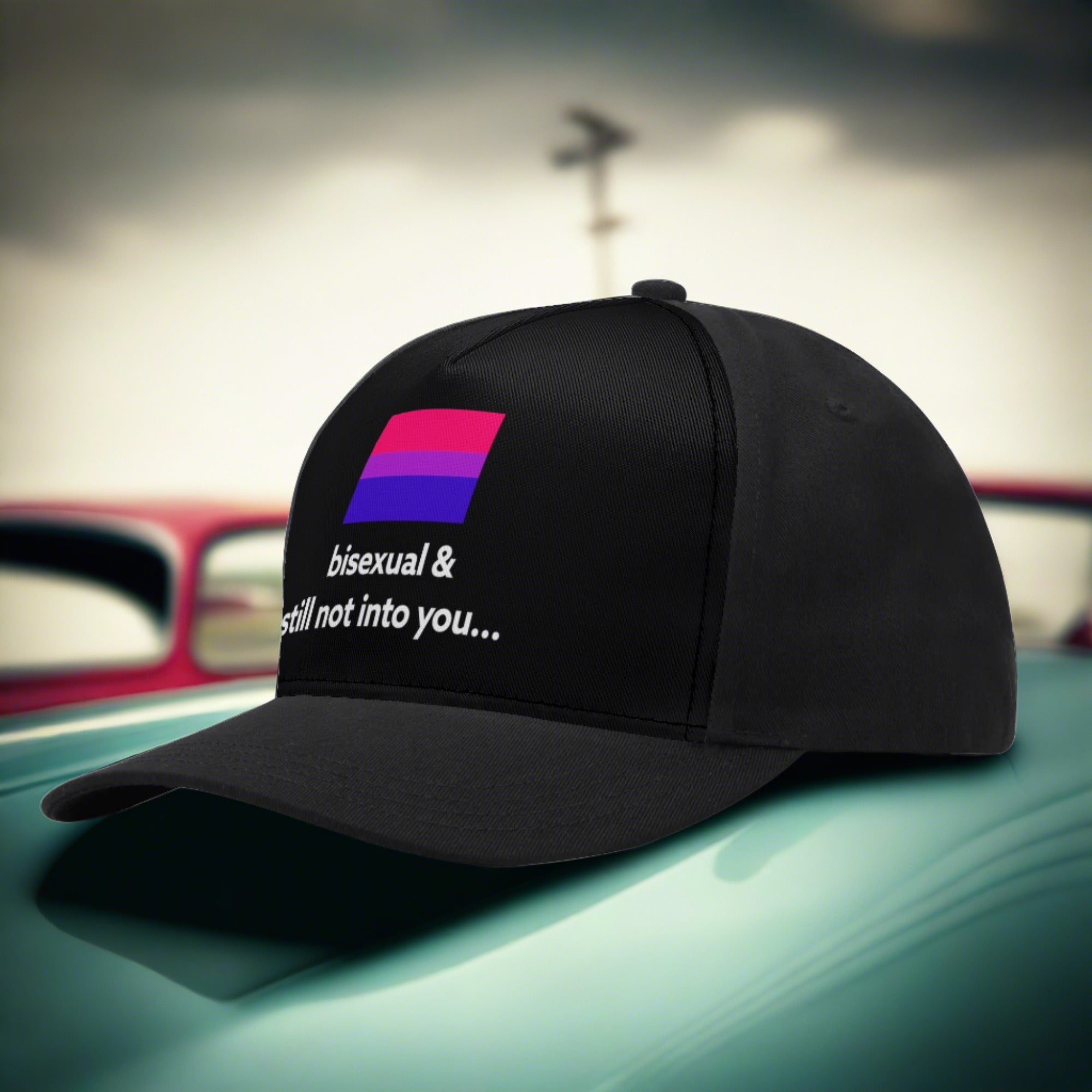 bisexual and still not into you pride hat sitting on a vintage car