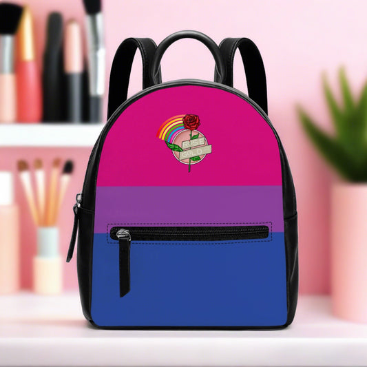 Bisexual Pride Mini  Backpack sitting on a makeup table