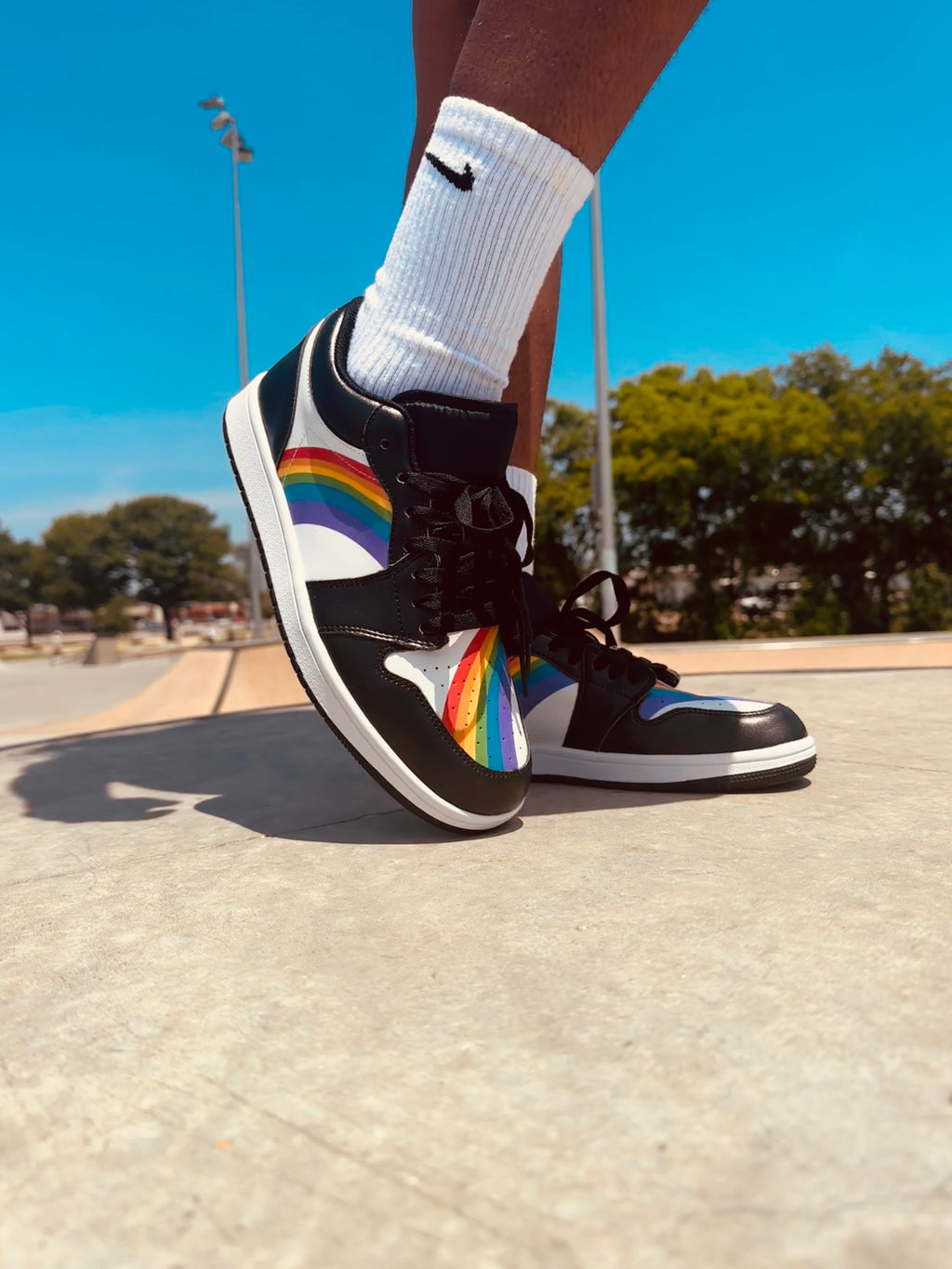 Rainbow pride black low-top sneakers, detail view — Rose Gold Co