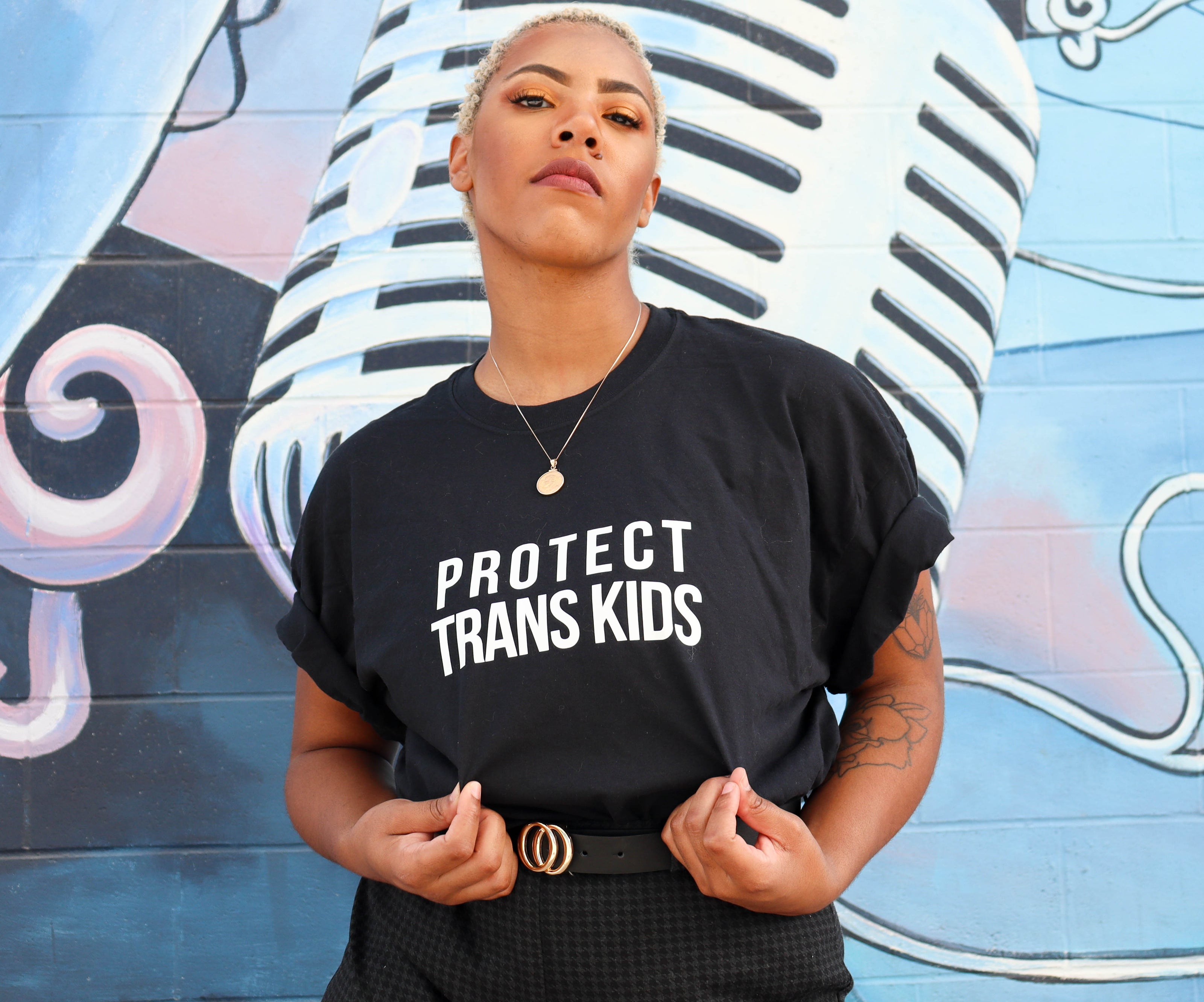 Girl wearing protect trans kids shirt