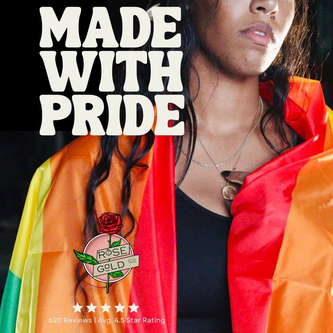 Girl wearing gay rainbow pride flag as a cape with rose gold co logo 