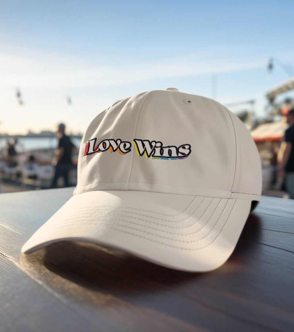 Love Wins embroidered dad hat, front view — Rose Gold Co