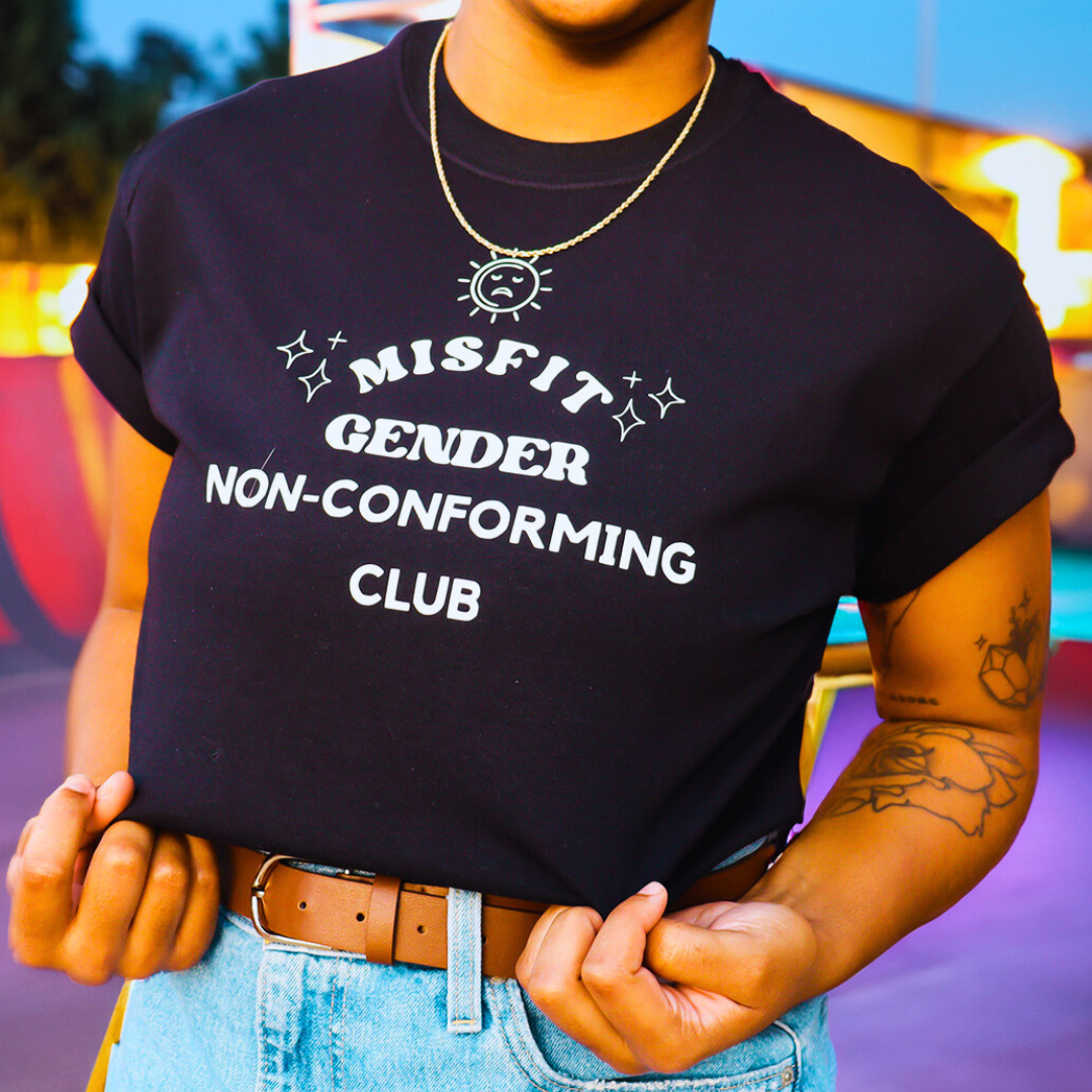 person wearing misfit gender non conforming non-binary pride shirt