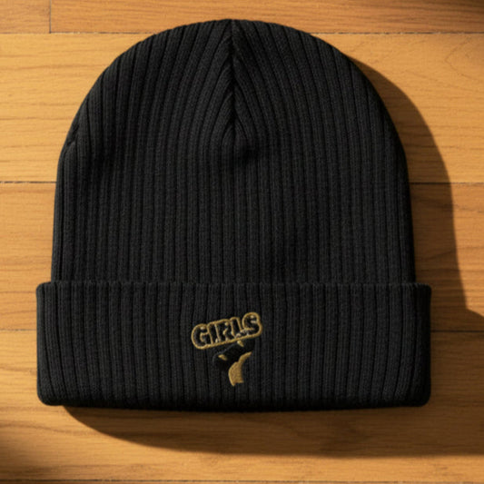 Black beanie with a gold logo on a wooden surface